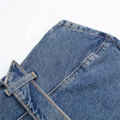 Close-up of blue denim corset top with stitching and belt loop in blue denim fabric