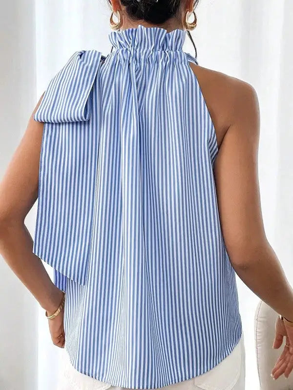 Blue and white striped sleeveless top with ruffled high neck and shoulder tie detail