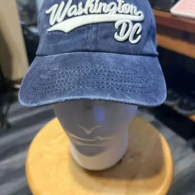 Distressed navy blue Washington DC baseball cap with white embroidered text