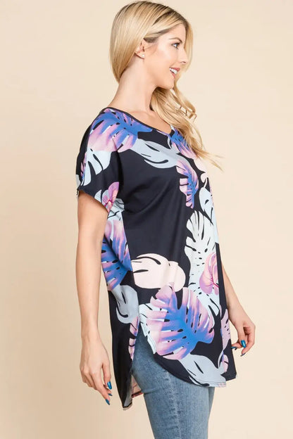 Black tropical print tunic top with round neck short sleeves and asymmetrical hem
