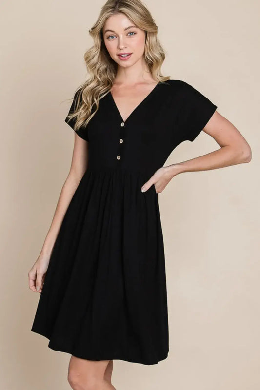 Black short sleeve dress with cap sleeves and flared skirt made of soft rayon spandex