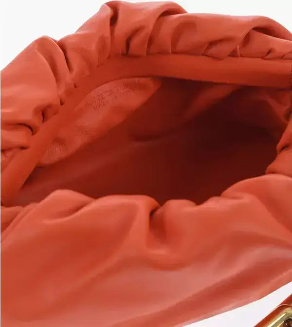 Orange Bottega Veneta chain pouch bag with roomy interior and magnetic closure