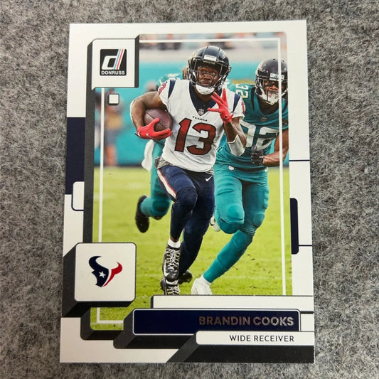 Donruss football trading card of Brandin Cooks Houston Texans Dallas Cowboys 2022-2024