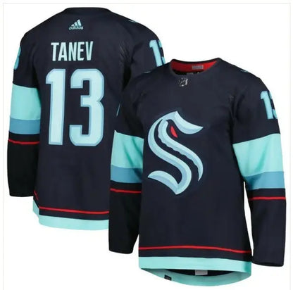 Dark blue Seattle Kraken hockey jersey with teal accents and large S logo front