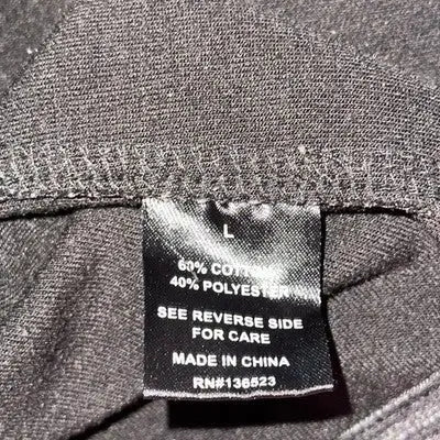 Grey fabric clothing tag with care instructions for Brooklyn Cloth MFG Men’s Black White Combo Coat