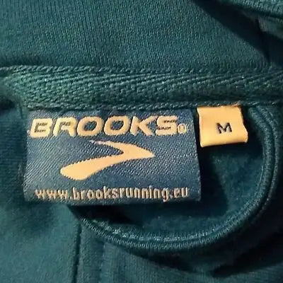 Brooks Boys teal zip hoodie apparel tag shown in Boy’s Blue Full Zip Hoodie size M
