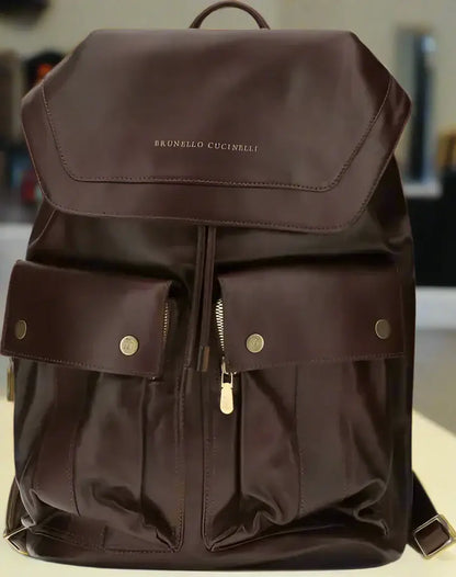 Brunello Cucinelli Mens leather backpack with flap closure drawstring and gold hardware