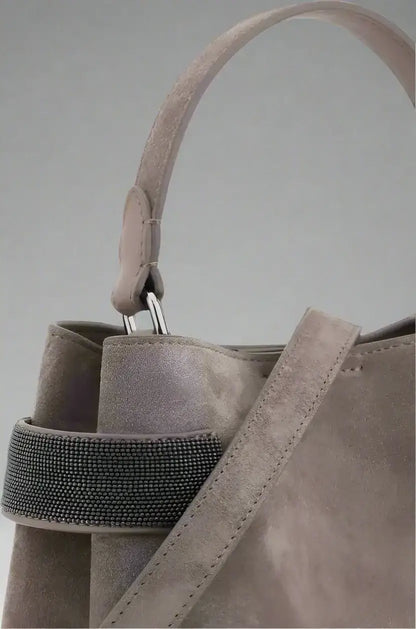 Light grey leather handbag with beaded strap and top handle by Brunello Cucinelli