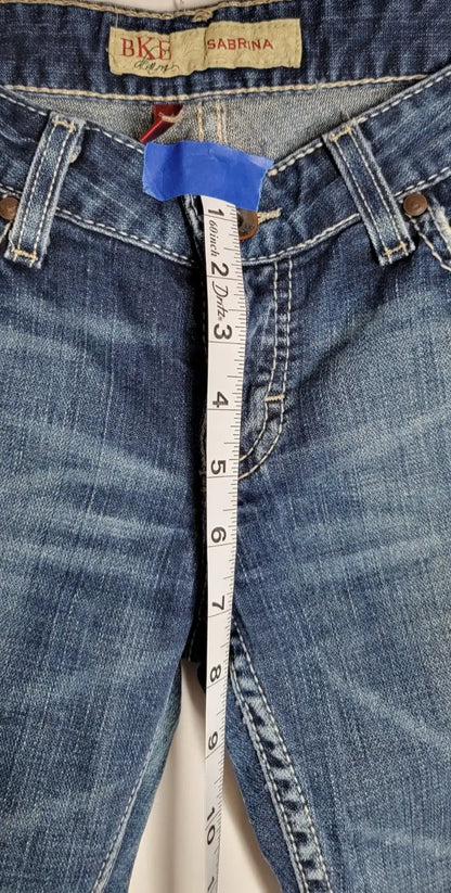 Blue denim jeans with measuring tape showcasing Buckle BKE Denim Sabrina bootcut style