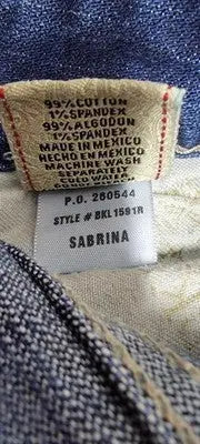 Clothing label for Buckle BKE Denim Sabrina jeans with material, care, and origin details
