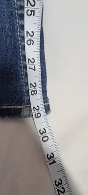 Dark blue buckle bke denim Sabrina jeans with measuring tape showing 29-inch inseam