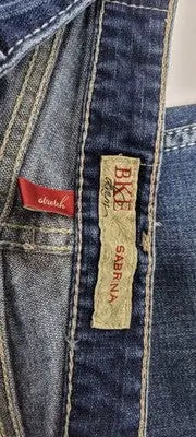 Dark wash buckle bke denim Sabrina jeans with red stretch tag and beige BKE Sabrina label