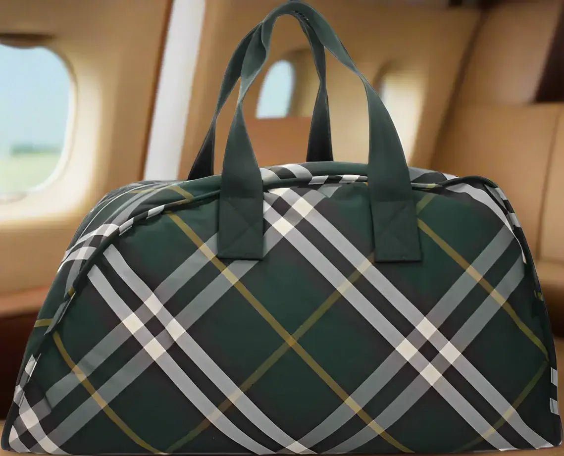 Dark green plaid Burberry mens green travel bag with black, white, and gold stripes