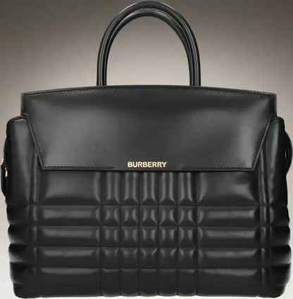 Black leather quilted handbag with top handles and front flap from BURBERRY women