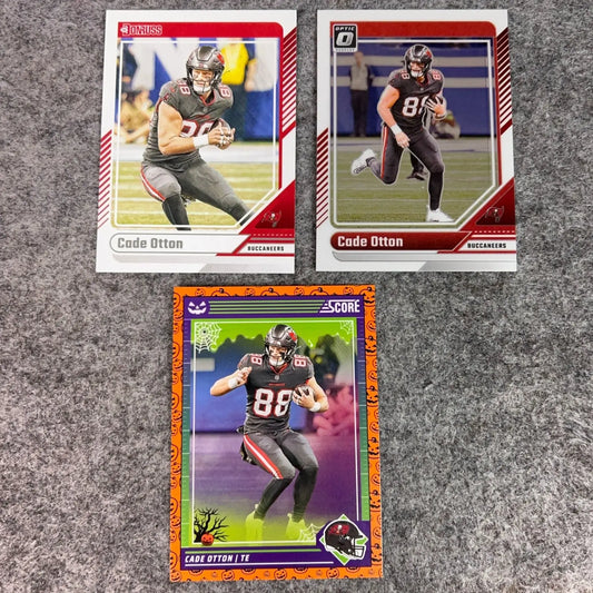 Three sports trading cards featuring Cade Otton in a Tampa Bay Buccaneers football uniform