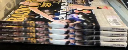 Stacked Caitlin Clark Beckett Basketball magazines showcasing price guide for April 2024