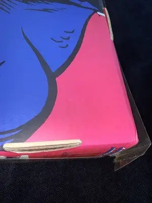 Vibrant blue and pink graphic novel with a slightly damaged corner for Captain America Marvel figure