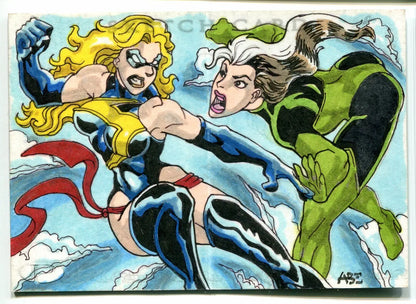 Comic book sketch card by Anthony Escartin Abe featuring Captain Ms. Marvel and Rogue
