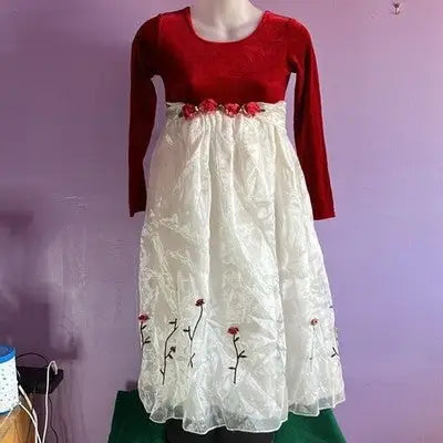 Red velvet empire waist dress with white embroidered overlay and floral waist embellishments
