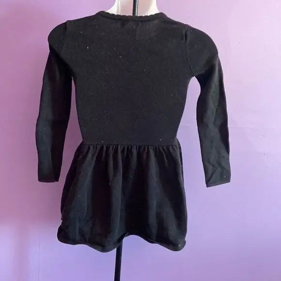 Black long-sleeved dress with ruffled waist from Cat & Jack Girl’s Star Pattern collection