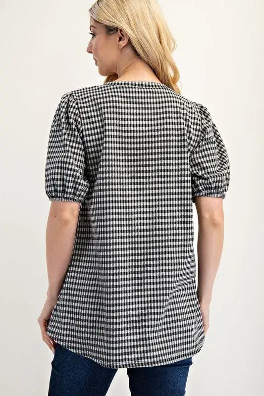 Black and white gingham print plus size blouse with puff sleeves and relaxed fit