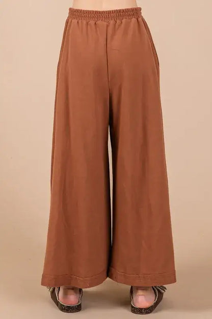 Brown wide-leg pants with elastic waistband and sandals from Ces Femme half button half set