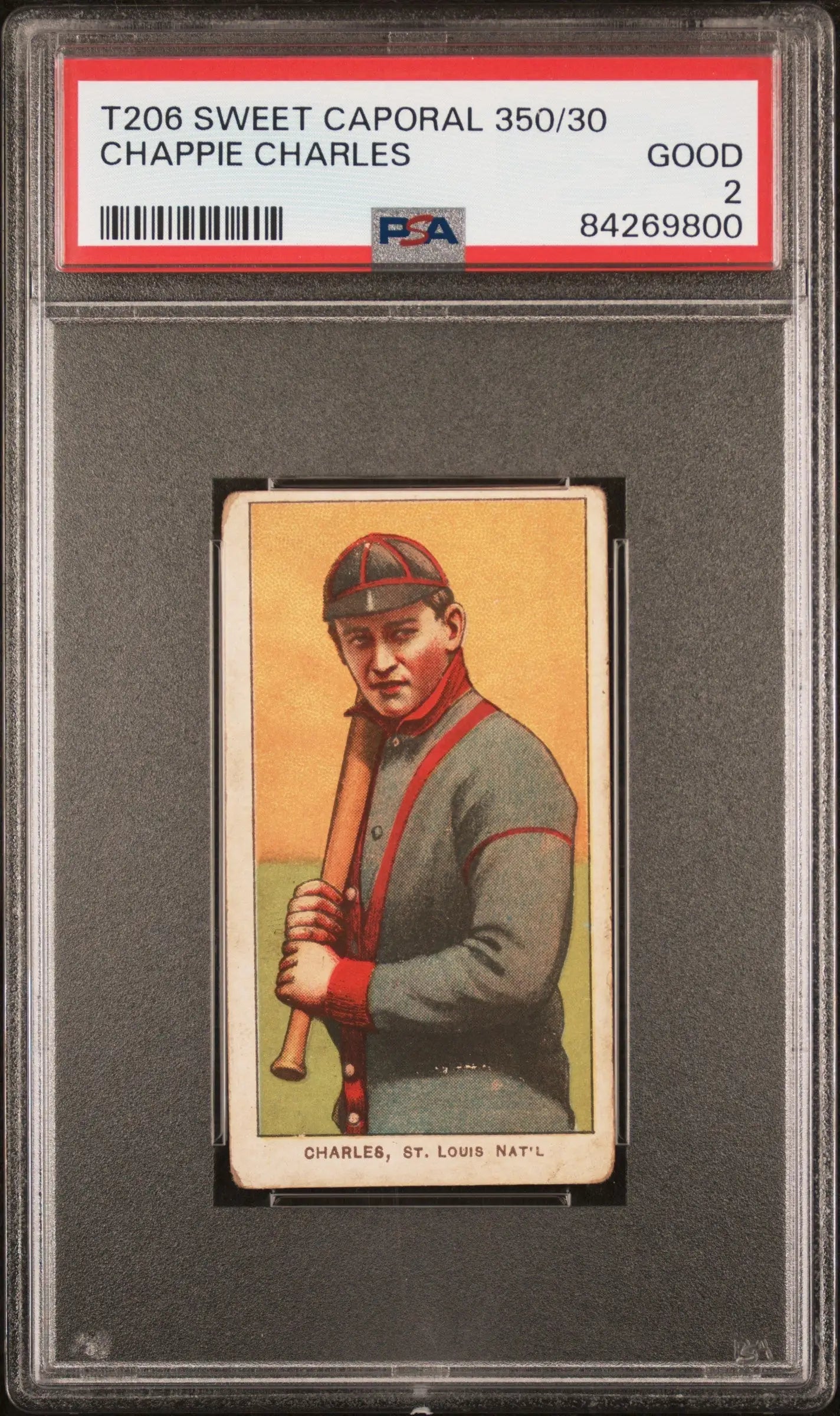 PSA-graded T206 Sweet Caporal card of Chappie Charles in gray sweater on orange backdrop