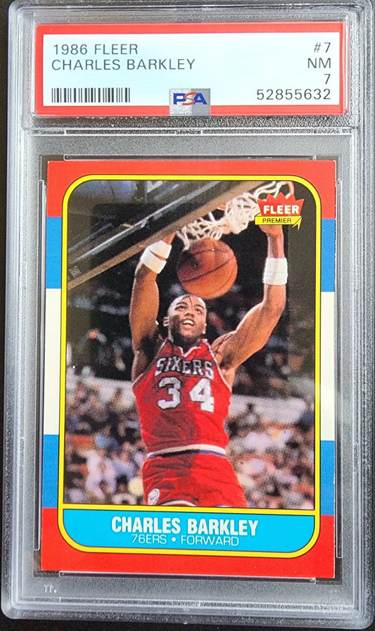 PSA-graded Charles Barkley 1986 Fleer #7 trading card in red 76ers jersey shooting