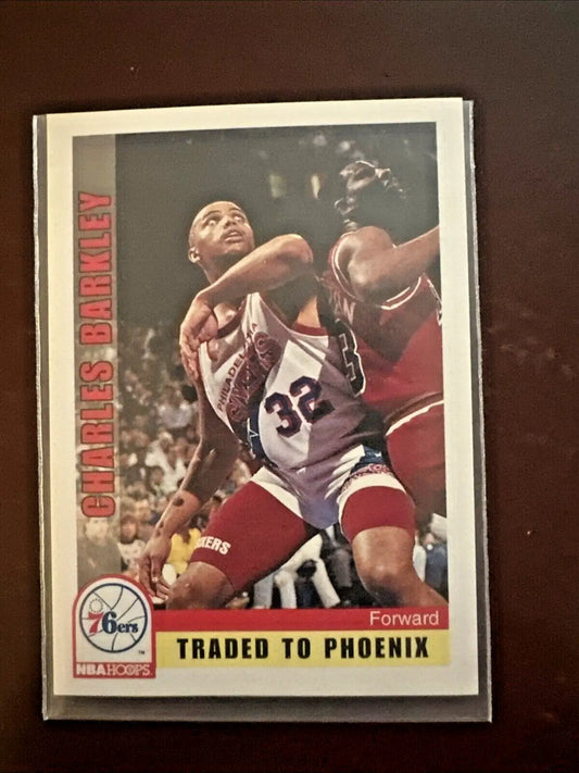 Charles Barkley NBA Hoops basketball card showing him in 76ers uniform with traded to Phoenix banner