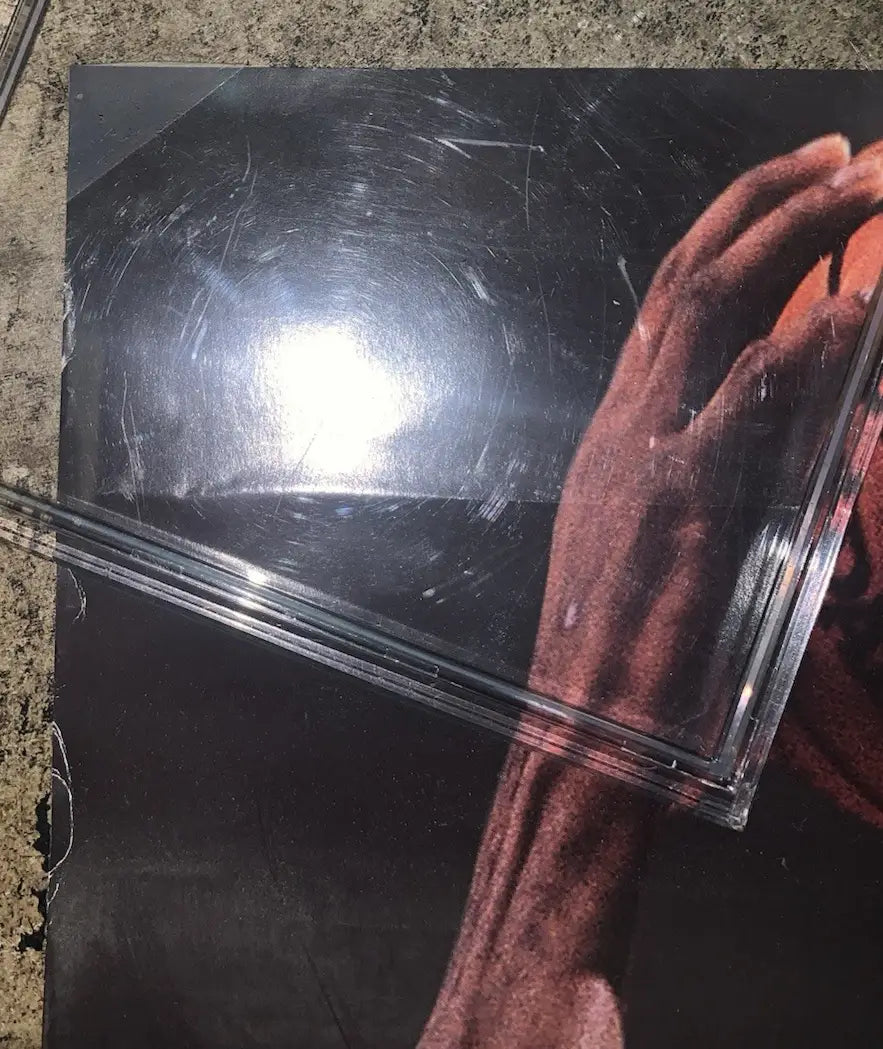 Scratched glossy Chicago Bulls Michael Jordan sports memorabilia poster with arm and hand