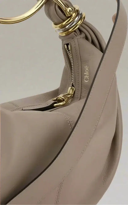 Light taupe leather chloé bracelet handbag with gold and silver ring hardware