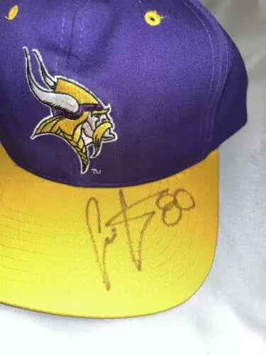 Purple and yellow Minnesota Vikings Eastport Snapback Cap signed by Chris Carter #80