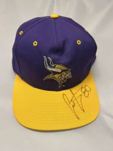 Purple and yellow Minnesota Vikings Eastport Snapback Cap signed by Chris Carter #80