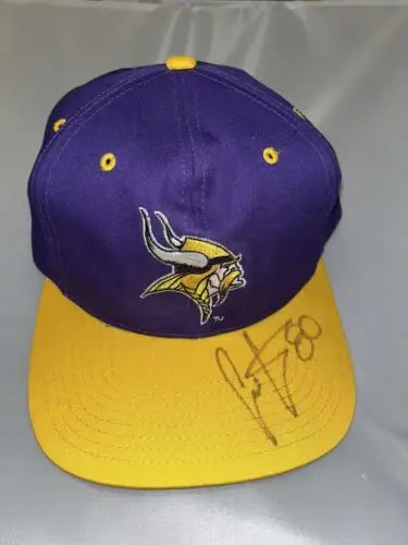 Purple and yellow Minnesota Vikings Eastport snapback cap signed by Chris Carter #80