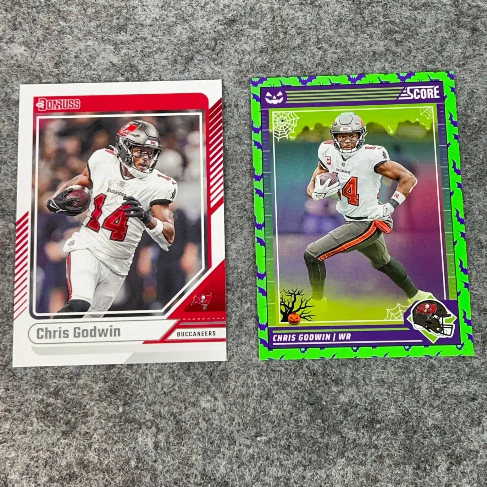Two Chris Godwin Tampa Bay Buccaneers 2024 NFL football trading cards displayed