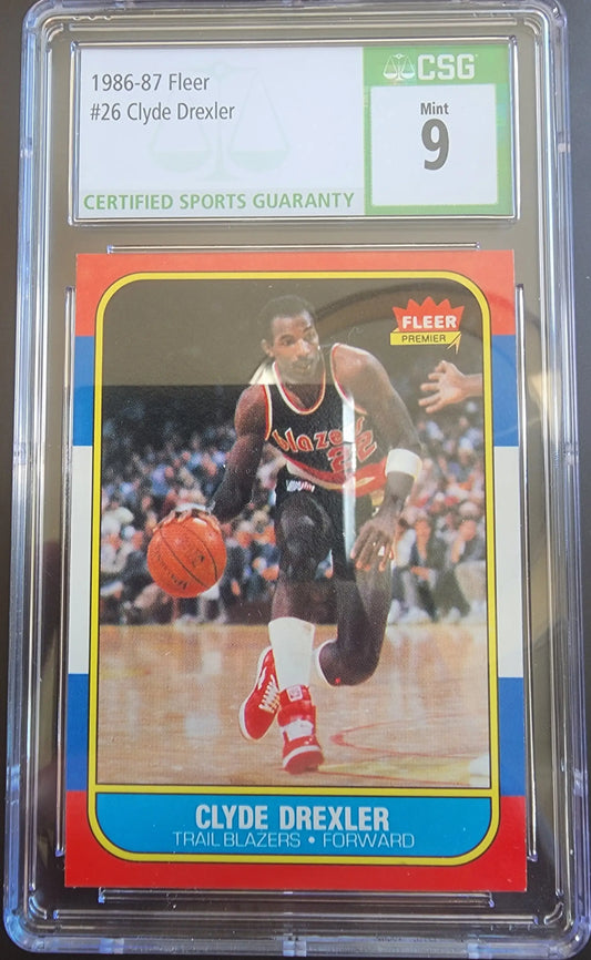 Clyde Drexler 1986 Fleer trading card showcasing player dribbling in black jersey