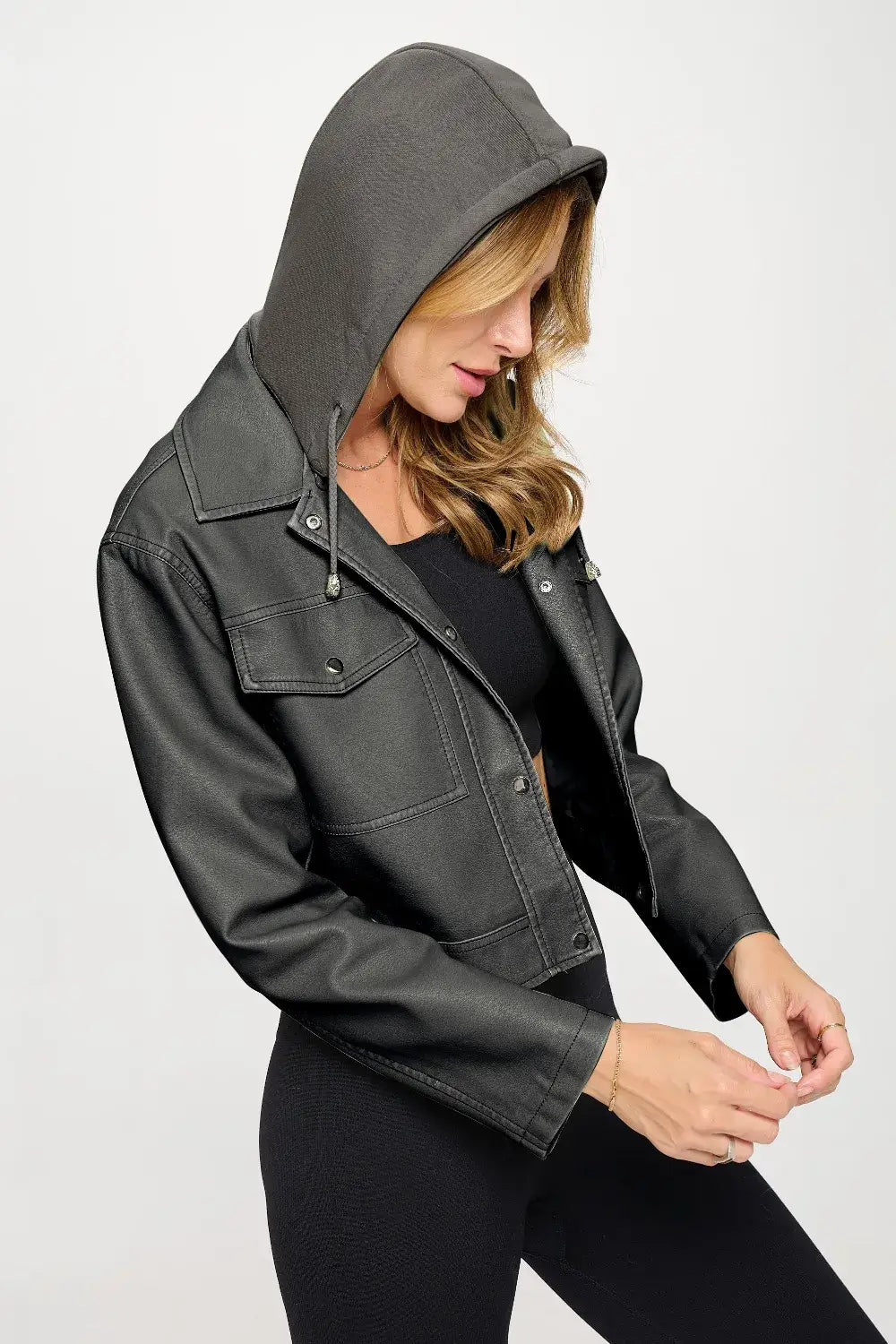 Charcoal gray cropped hooded jacket with black lining and button details from Coalition LA