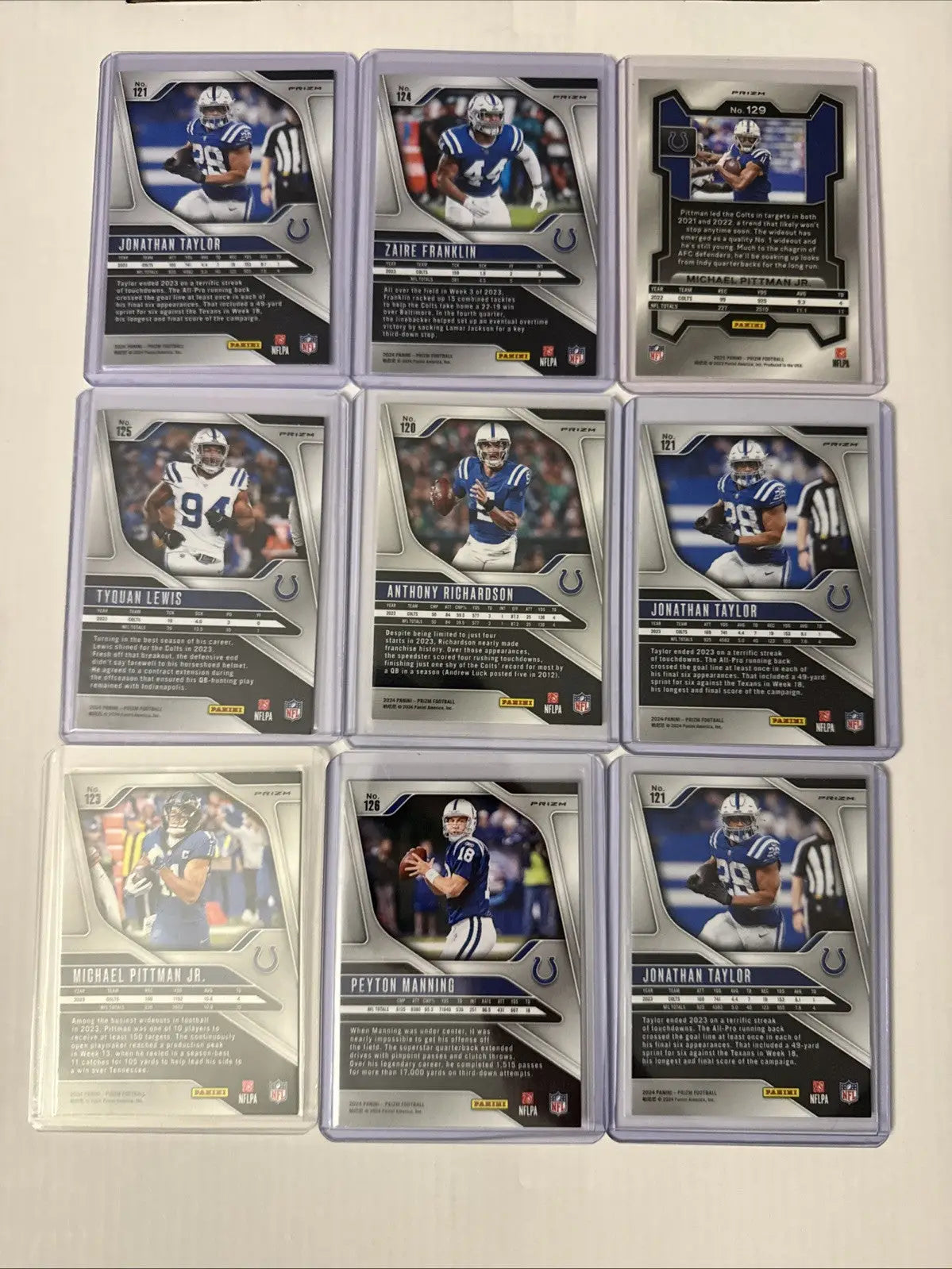 Indianapolis Colts sports trading card lot featuring Peyton Manning and team stars in protective sleeves