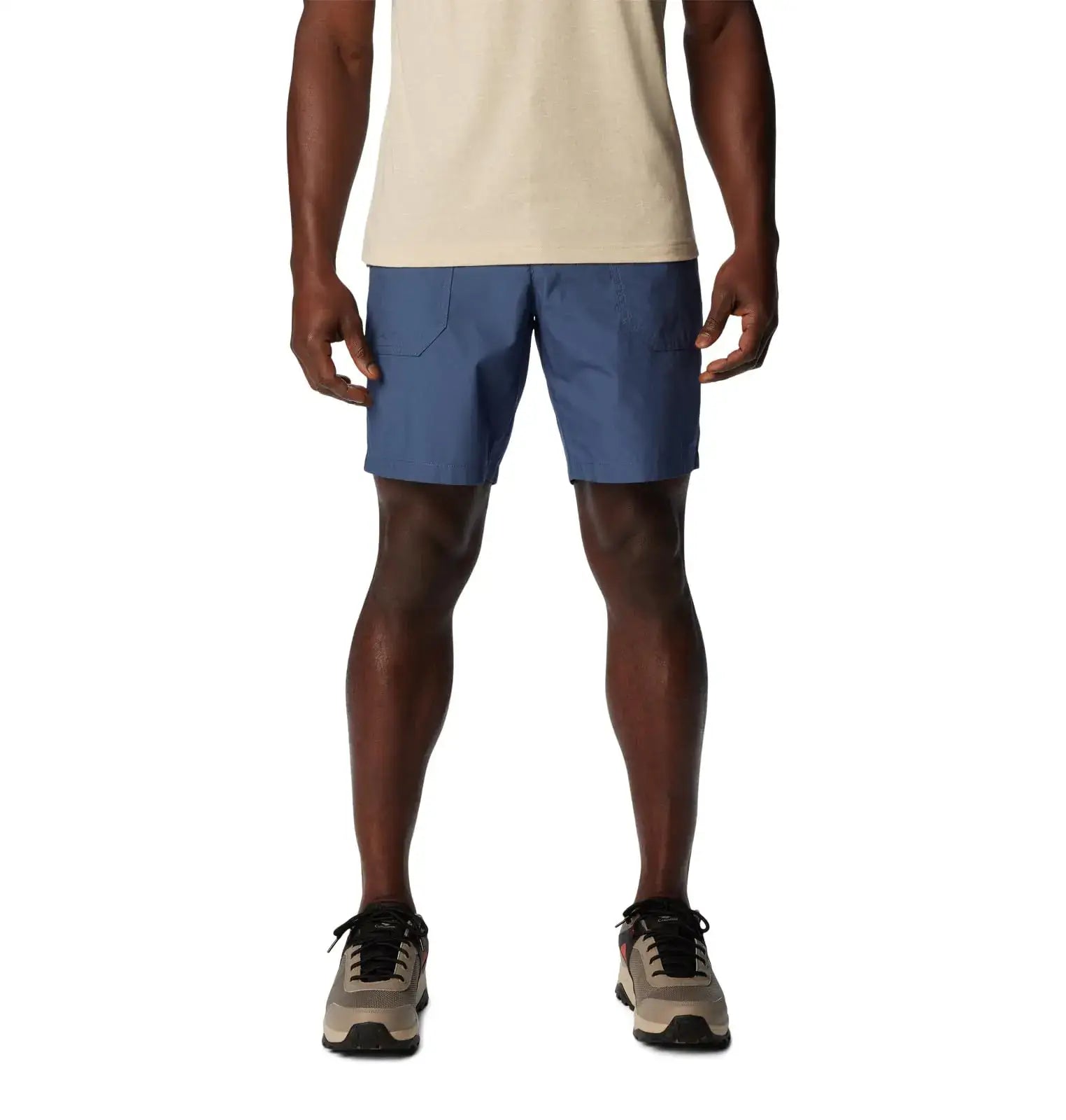 Man wearing Columbia Mens Washed Out Cargo Shorts in Dark Mountain with sneakers