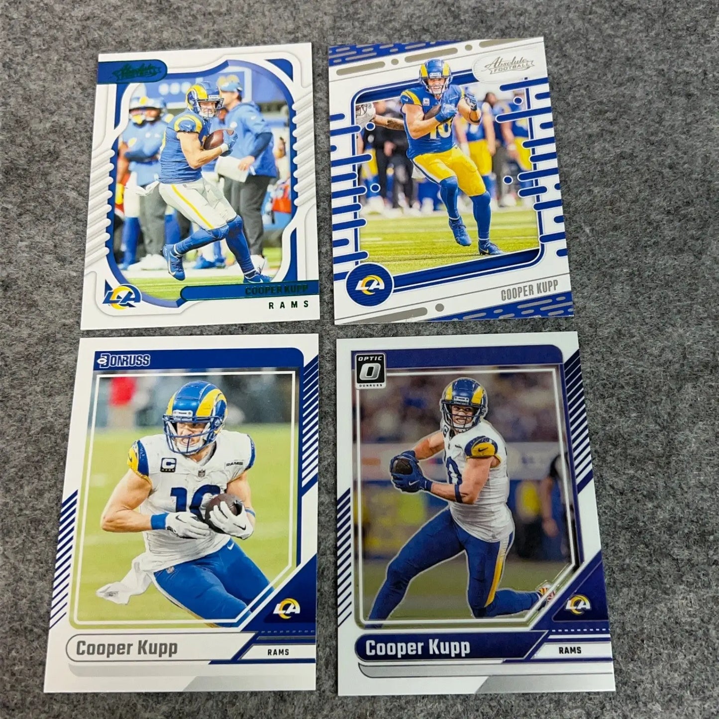 Four Cooper Kupp Los Angeles Rams football trading cards from 2022 to 2024 NFL seasons