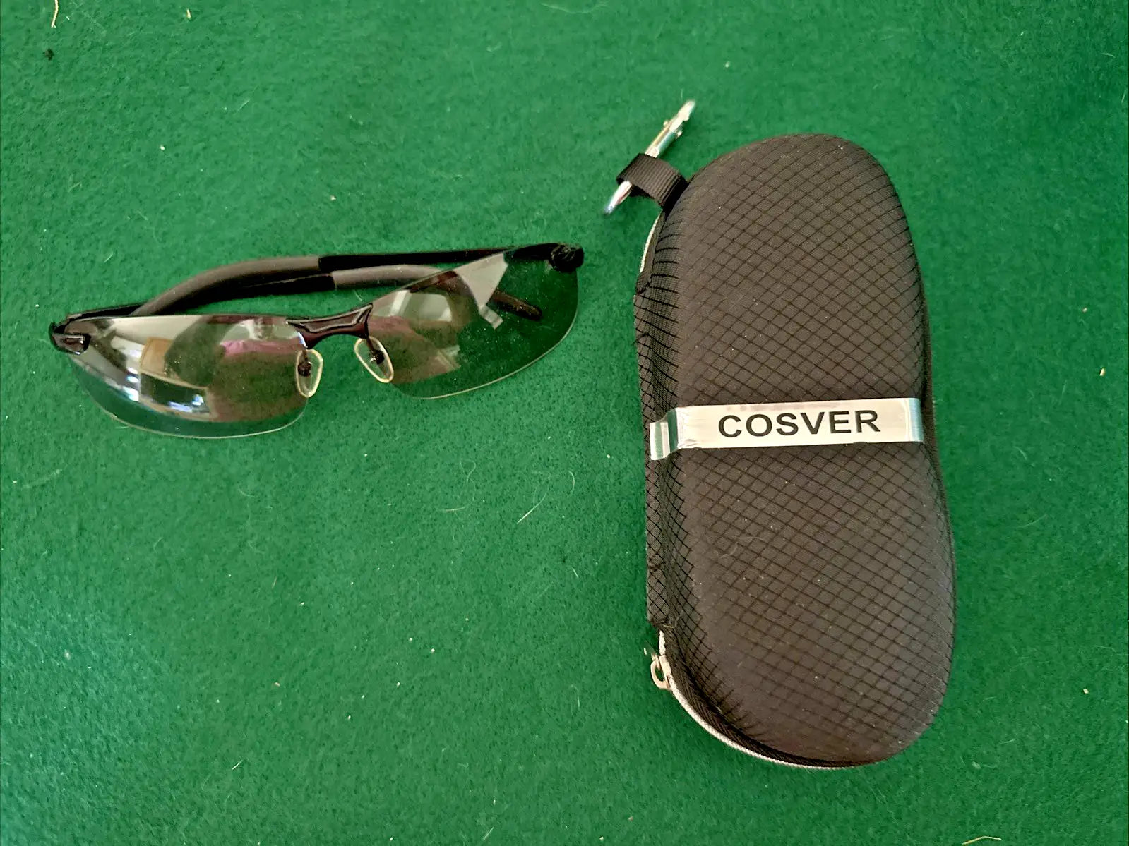 Black-framed rimless sunglasses with textured protective case for Men’s UV Sport Eyewear