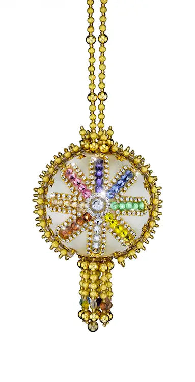 Ornate gold and jewel-encrusted pendant from Cracker Box Christmas Ornament Kit with colorful design