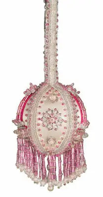Ornate pink and white beaded Christmas ornament with fringes from Cracker Box Baby Boobie kit