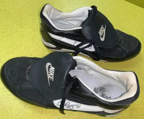 Black and white Nike soccer cleats photo matched to Craig Biggio, autographed by Gene Pemberton