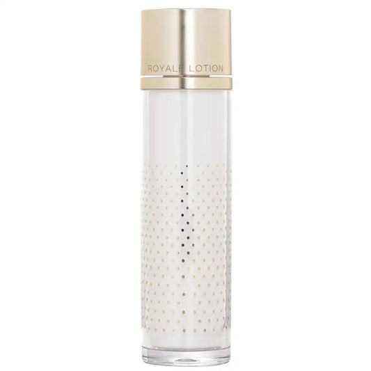 Elegant Creme Royale Active Lotion in a clear bottle with a gold cap and textured design
