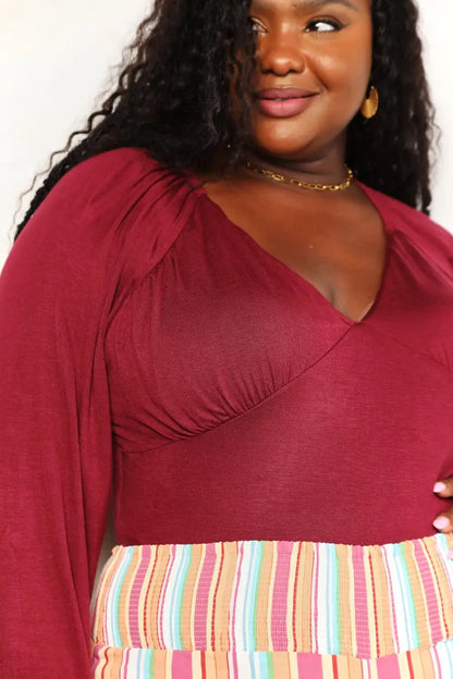 Burgundy Culture Code size V-neck bodysuit with poet ruffled sleeves and striped hem