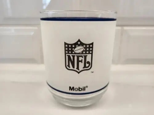 Frosted glass tumbler featuring Dallas Cowboys helmet logo and Mobil Oil design
