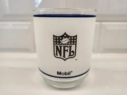 Frosted glass tumbler featuring Dallas Cowboys helmet logo and Mobil Oil design
