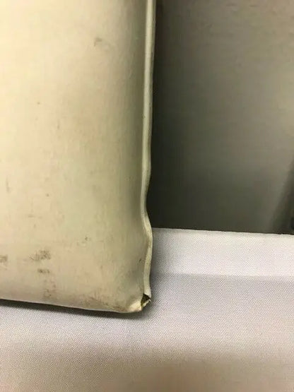Worn off-white corner of Dallas Cowboys Vintage 1970’s Seat Cushion Texas Stadium