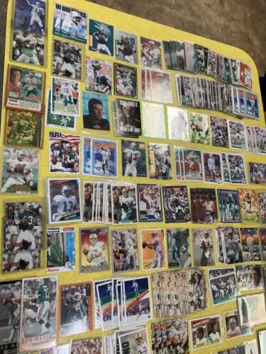 Collection of Dan Marino Miami Dolphins football trading cards from Upper Deck, Topps, and Score